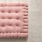 Padded dog bed made of biscuit dough.